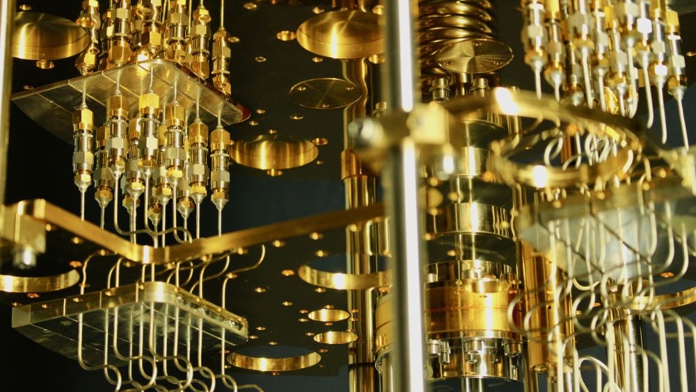Close-up of gold-plated components and wiring of a quantum computer processor.